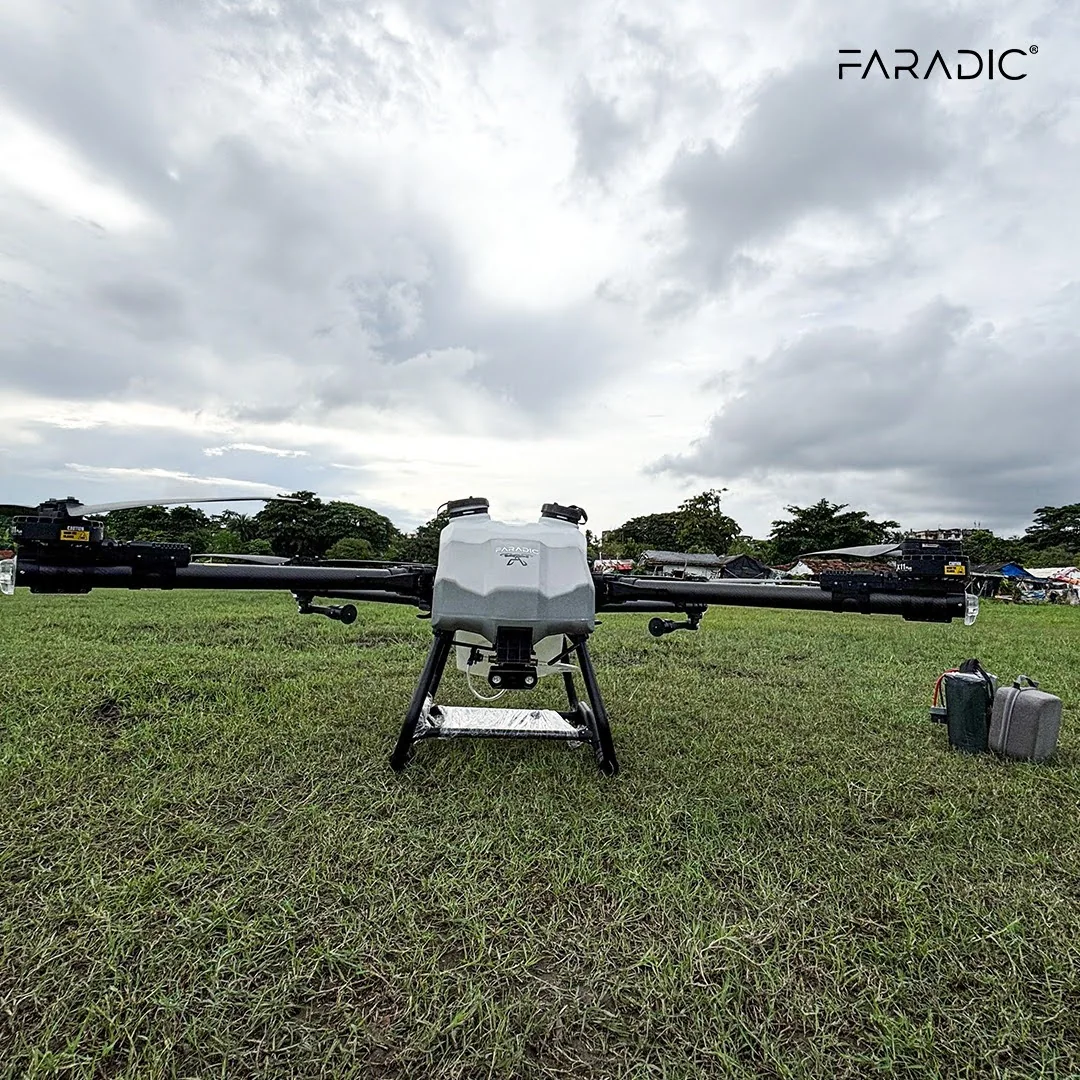 Faradic agricultural drone with batteries on the grass