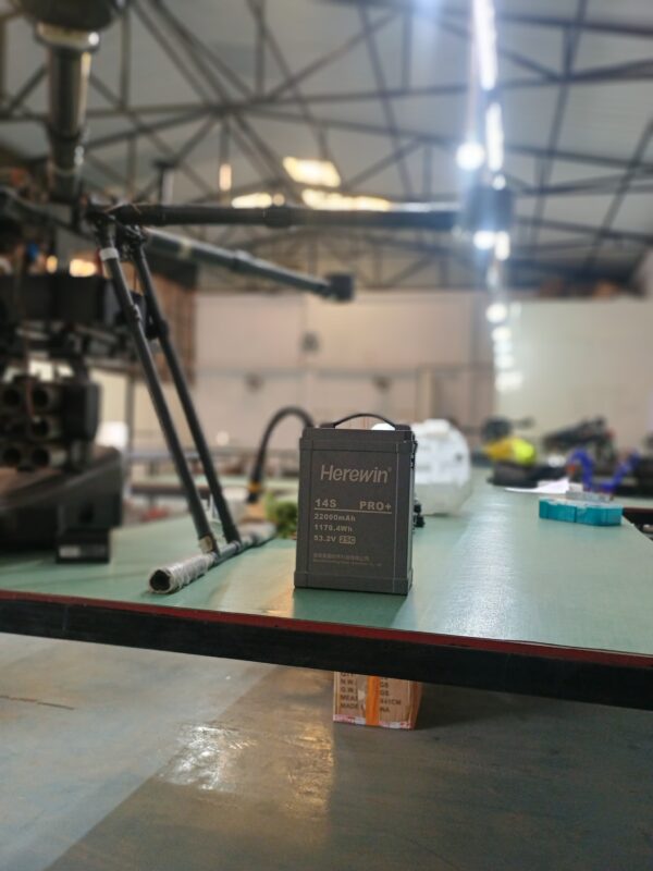 Herewin 14s Pro 22000mAh high-performance LiPo battery for industrial and agricultural drones. A Herewin 14s battery can be seen placed in the Drone warehouse. 