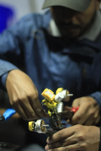 Inspecting drone components in the workshop