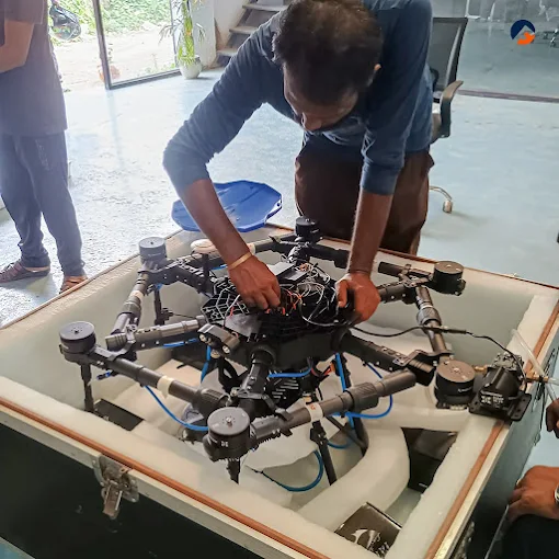 Flycast team member inspecting a drone